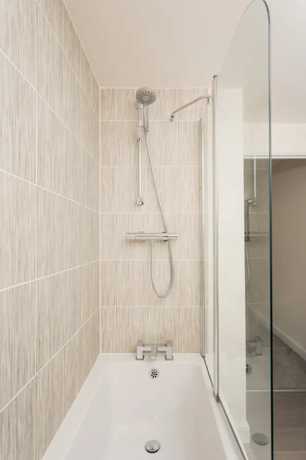 Family bathroom with bath and shower