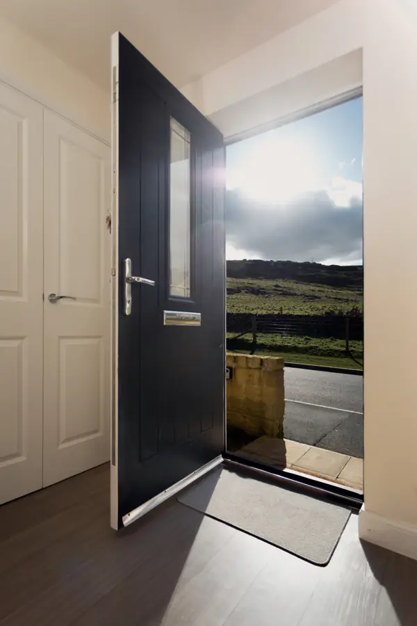 Front door open to the moor