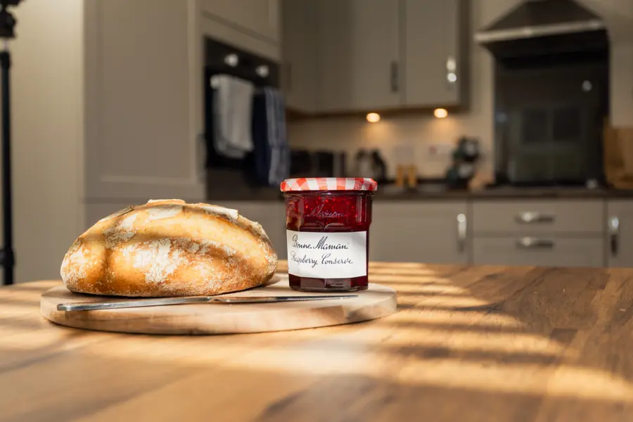 Fresh bread and jam on the dining table